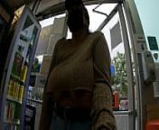 Woman pumps gas and pays cashier with her big tits out from cashier
