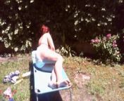 Nicoletta sunbathes in a public garden wearing a big dirty diaper from enema sex